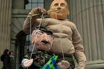 Putin holding a puppet Lukashenko - Getty images